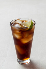 Alcoholic cocktail of rum with ice and lime, close-up, macro photography.