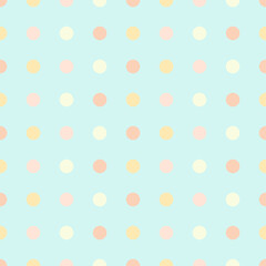 Children's pattern in colored polka dots in pastel colors.