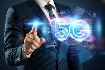 Over hand of businessman 5G hologram, creative background. 5G network concept, high speed mobile internet, new generation networks. Mixed media.