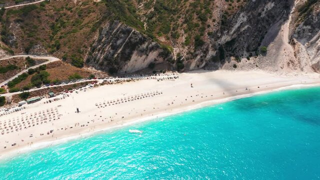 Aerial view of  umbrellas by the exotic turquoise sea of Myrtos beach at Kefalonia island, Greece