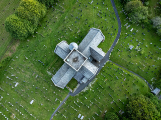 Avon Gifford St Andrew's. An old cruciform church building in Devon, UK. Drone aerial view