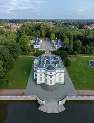 Top view of Castle Hof ter Linde in Edegem near Antwerp by a lake or pond. Drone aerial view