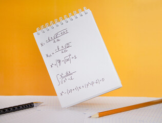Mathematical equations written in a notebook. Math homework. The concept of education and training