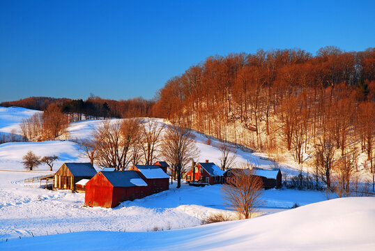 A Vermont Farm is nestled under a blanket of snow - Powered by Adobe
