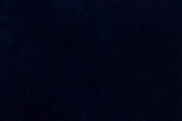 Dark non-uniform paper with spots and inclusions.