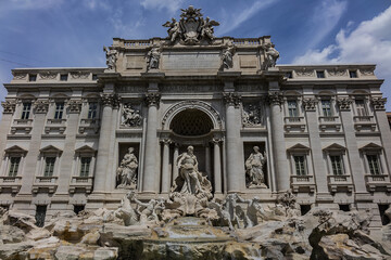 Fototapeta na wymiar Trevi Fountain (1762) - most famous and arguably the most beautiful fountain in all of Rome. Impressive monument dominates the small Trevi Square. Rome, Italy.