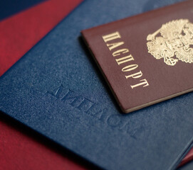 documents Russian passport and diploma on top of each other