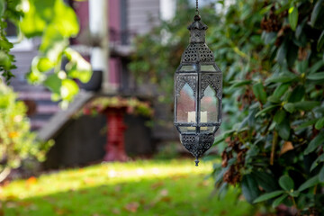 A decorative candle holder in yard