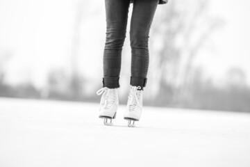 ice skating on a frozen pond in winter