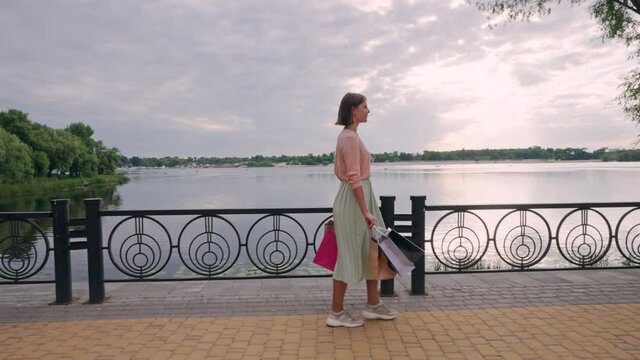 female stroll on riverfront