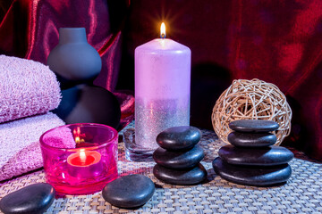 Obraz na płótnie Canvas Spa, zen basalt stones, towels, candles in the massage room.