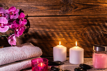 Spa, zen basalt stones, towels, candles in the massage room.