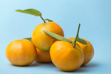 group of tangerines on blue background
