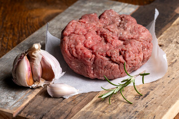 raw minced meat on dark wood