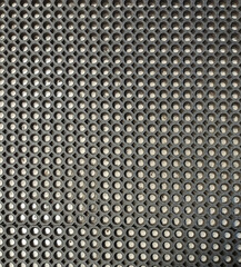 Pattern of dark wooden on cut of the tree with holes