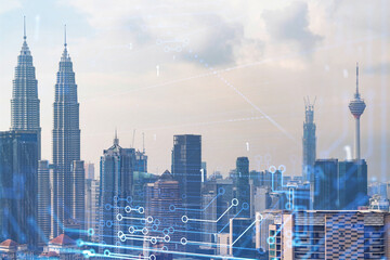 Fototapeta na wymiar Technology hologram over panorama city view of Kuala Lumpur. KL is the largest tech hub in Malaysia, Asia. The concept of developing coding and high-tech science. Double exposure.