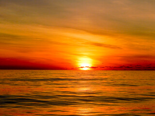 Fototapeta premium Sunset over the Atlantic Ocean in the Caribbean. Copy space. No people.