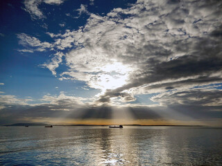 Naklejka premium Scenic seacape view of ships at dusk with calm sea. No people.