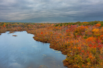 overcast aerial image of a fall lake