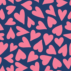 Pink hearts seamless repeat pattern. Random placed, vector love sign all over surface print on blue background.