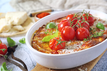 Cherry tomatoes clafoutis (or flan) with grated parmesan cheese