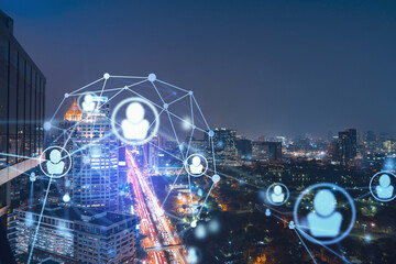 Glowing social media icons on night panoramic city view of Bangkok, Southeast Asia. The concept of networking and establishing new connections between people in businesses. Double exposure.