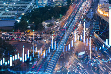 FOREX graph hologram over night busy road traffic in Bangkok, the developed location for stock...