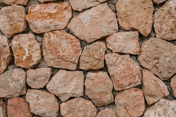 Marble bricks stone wall close-up . marble bricks texture of the walls. marble pattern of the brick wall. stone fence.
