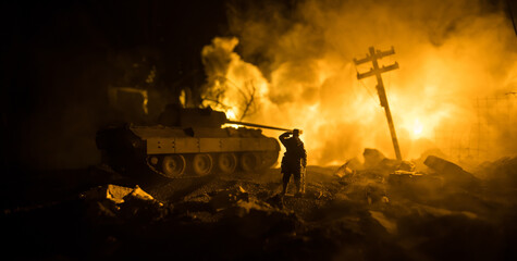 War Concept. Military silhouettes fighting scene on war fog sky background, World War Soldiers Silhouette Below Cloudy Skyline At night. Battle in ruined city. Selective focus