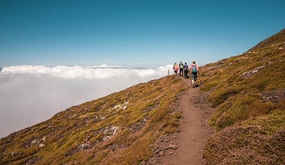 Obraz premium Hiking to the top of Pico Mountain, Azores hiker paradise, travel.