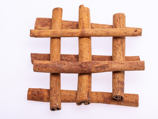 Cinnamon sticks, classic spice from the inner bark of tropical Asian trees, flavorful and aromatic for cooking, baking, health food and medicinal uses.