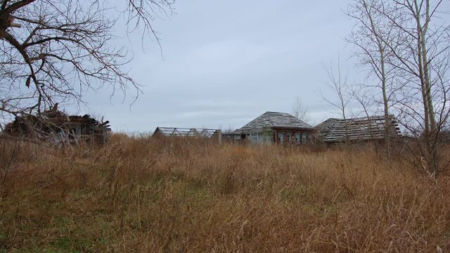 Old abandoned wooden houses in a Russian village.