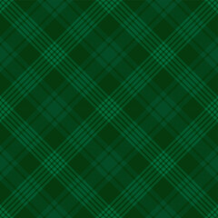 Green tartan plaid. Argyle Scottish pattern fabric swatch close-up. 