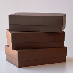 three brown boxes on a white background