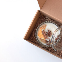 Candle in a box on a white background