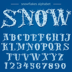Snowflakes Alphabet, Christmas Font, letters and numbers on blue background. Vector