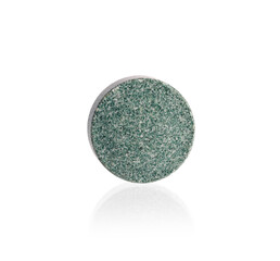 Single vitamin K pill isolated on white background