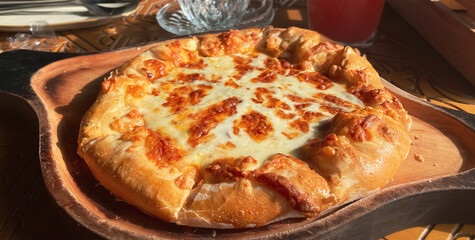 Close-up on a table in a restaurant cooked traditional Georgian dish khachapuri