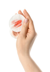 Female hand with used cotton pads on white background, closeup