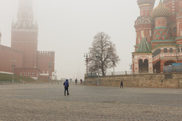 Moscow, Russia, Nov 2,2021: Heavy fog near The Kremlin. November People walking near St. Basil's...