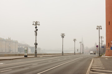 Moscow, Russia, Nov 2,2021: Heavy fog near The Kremlin. November Traffic at Kremlevskaya embankment,