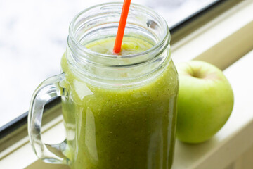 Closeup green smoothie in glass healthy fruits apples raw organic vitamin sweet juice drinks beverage fresh