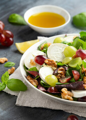 Italian salad with goat cheese, grapes and walnuts. Healthy Food