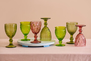 Stylish glasses on table in room