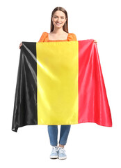 Young woman with flag of Belgium on white background