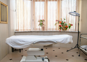 massage room. Beauty and body care. Interior of a new beauty salon with a massage table. Empty room...