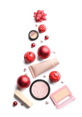 Beautiful Christmas tree made of makeup cosmetics and decor on white background