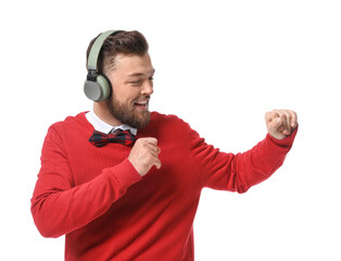 Young man with headphones dancing on white background