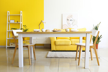 Dining table with cookies in interior of bright room