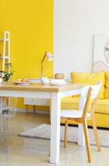Dining table with cookies in interior of bright room